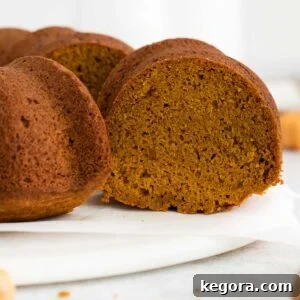 A close-up of an unfrosted pumpkin bundt cake