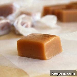 one caramel cube on parchment paper