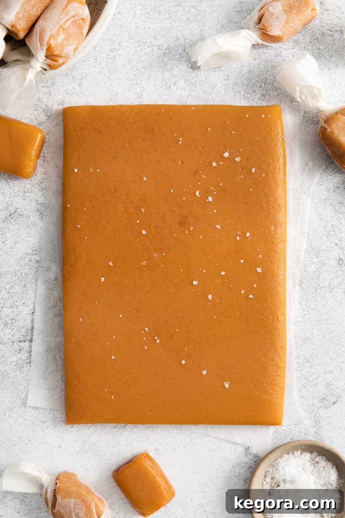An overhead view of a slab of caramel, before cutting