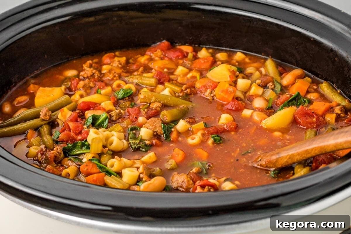 Slow Cooker Minestrone: Effortless & Hearty 8 Slow Cooker Minestrone Soup closeup in crockpot.