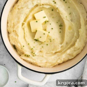 Creamy Gluten-Free Mashed Potatoes 8 A close-up photo of gluten-free mashed potatoes in a pot, ready to be served.