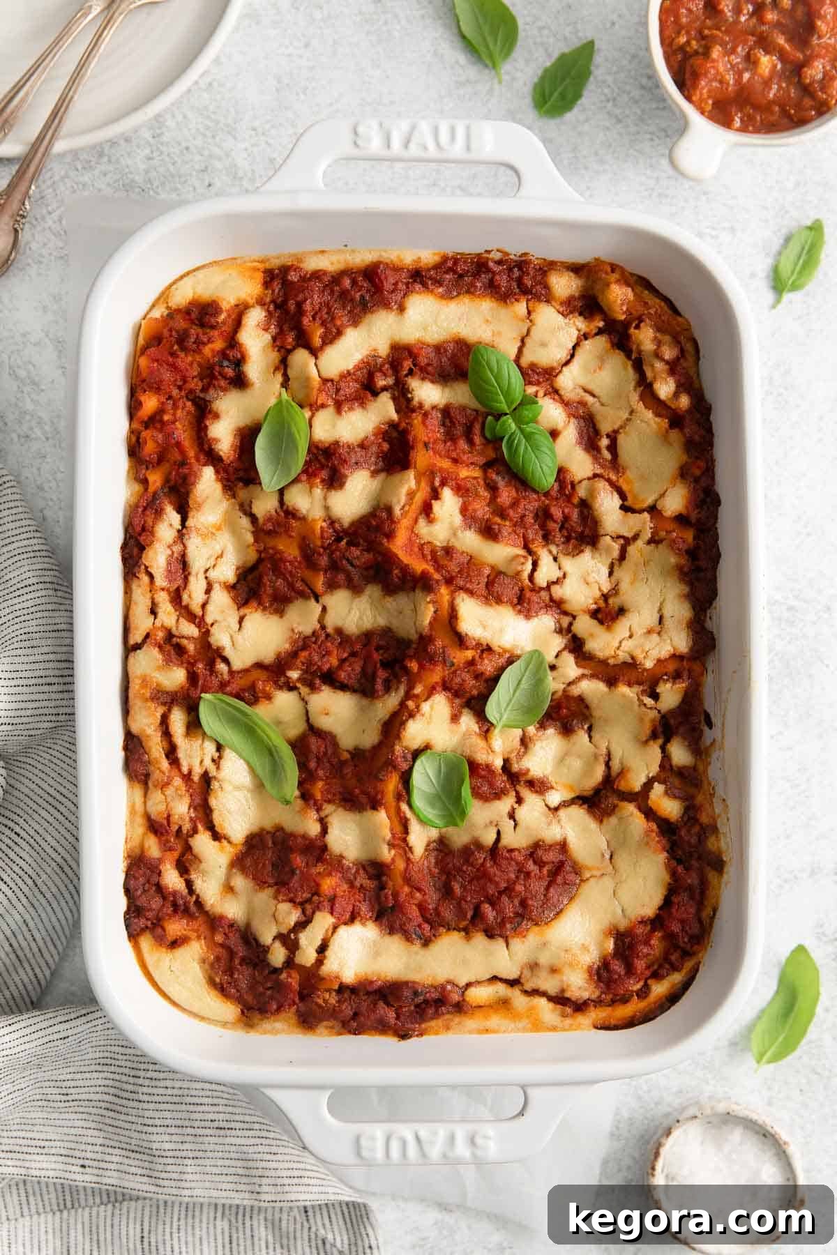 Luscious Dairy-Free Lasagna 2 An overhead view of dairy-free lasagna in a baking dish, showcasing its rich layers and golden-brown top.