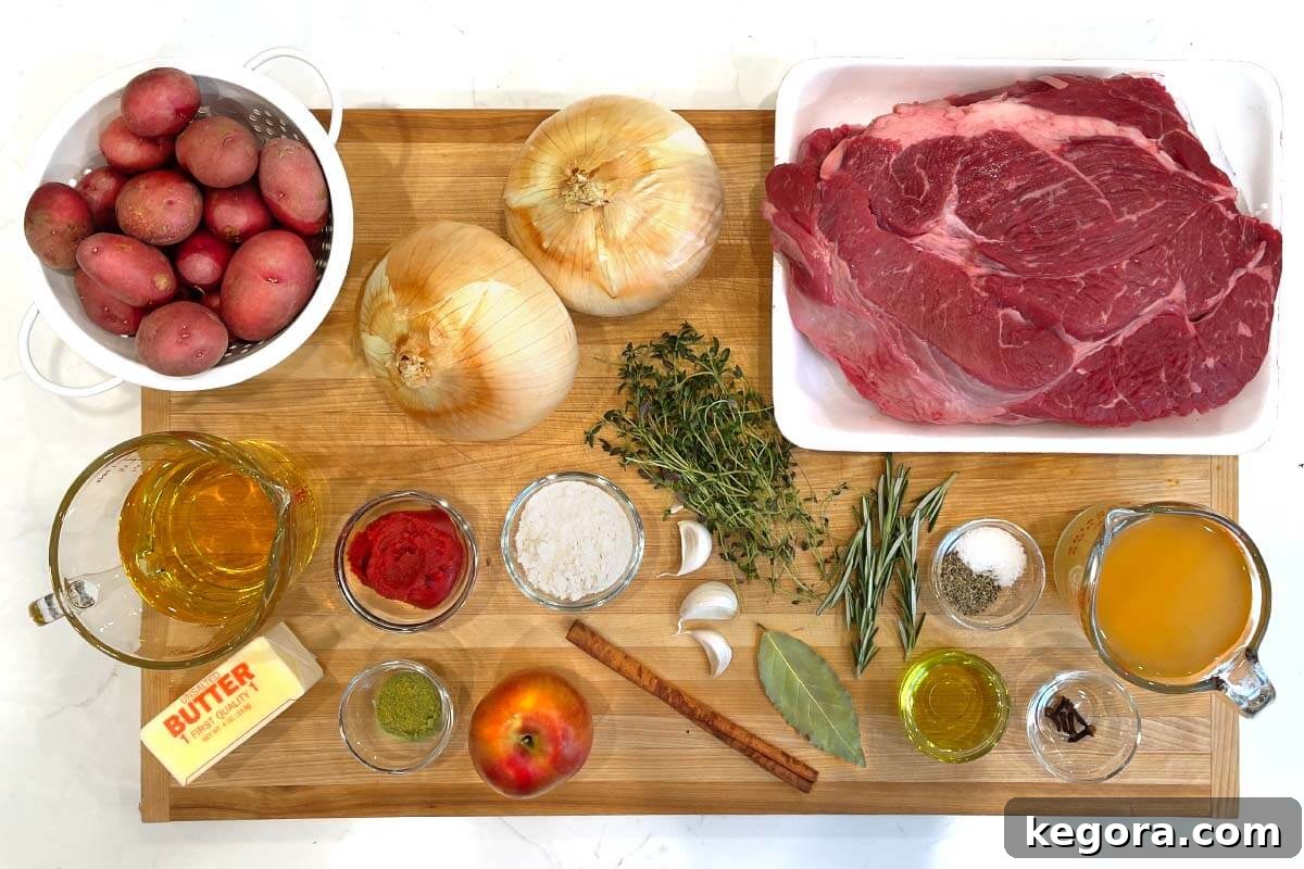 A visually appealing flat lay of all the fresh ingredients required to prepare the Apple Cider Pot Roast, showcasing their vibrant colors and textures.