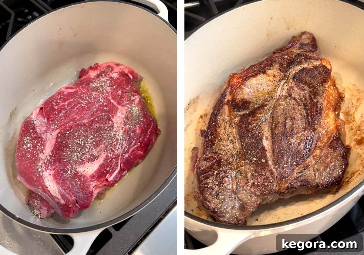 A thick chuck roast being expertly browned in a heated Dutch oven, creating a delicious crust.