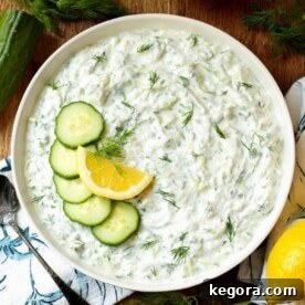 Tzatziki Sauce in a bowl with garnishes
