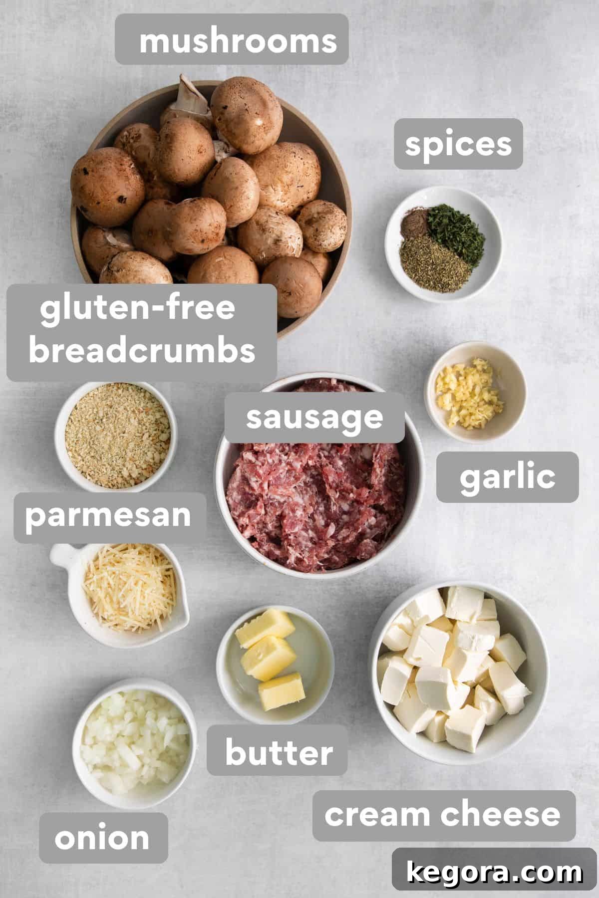 All the fresh ingredients for stuffed mushrooms laid out on a kitchen countertop.