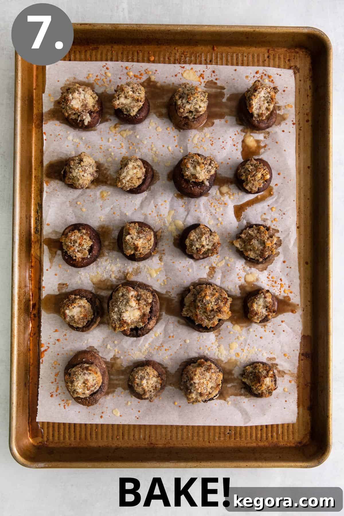 Freshly baked gluten-free stuffed mushrooms, golden brown and tender, on a baking sheet straight from the oven.