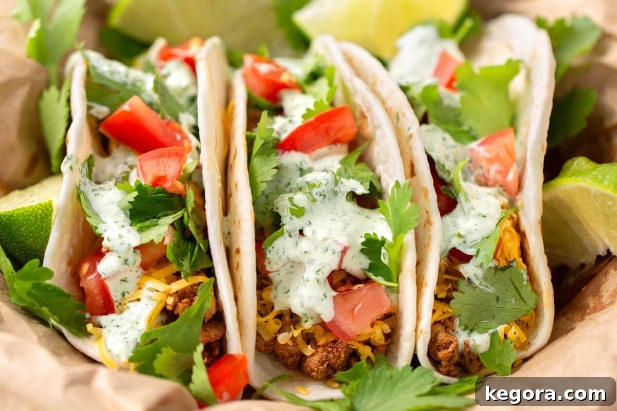 Vibrant Cilantro Cream 3 Three delicious turkey street tacos generously drizzled with homemade Cilantro Cream Sauce and topped with fresh garnishes