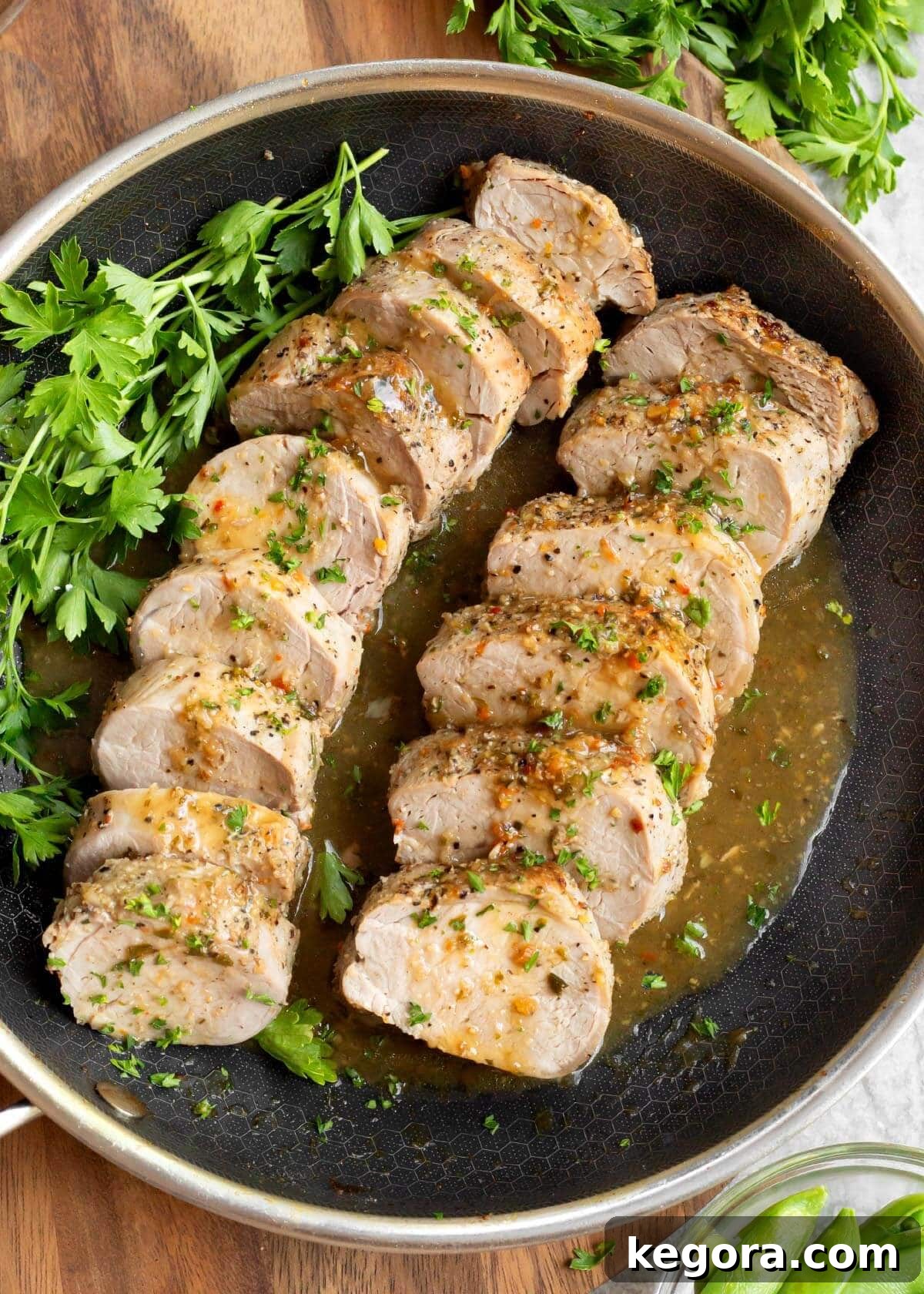 2 Easy Baked Pork Tenderloin sliced in a skillet