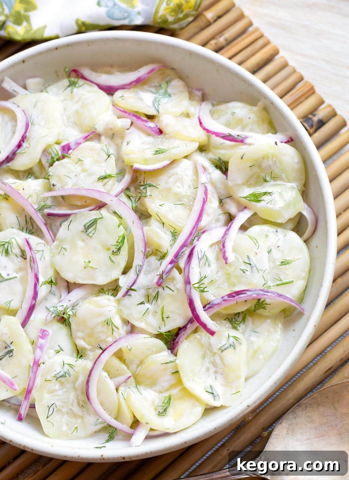 Fresh Dill Cucumber Delight 2 Creamy Dill Cucumber Salad in a white bowl