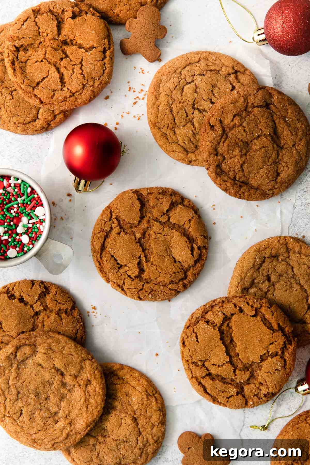 Zesty Gluten-Free Ginger Bites 6 Beautifully arranged gluten-free gingersnaps on a festive countertop with holiday ornaments and sprinkles.