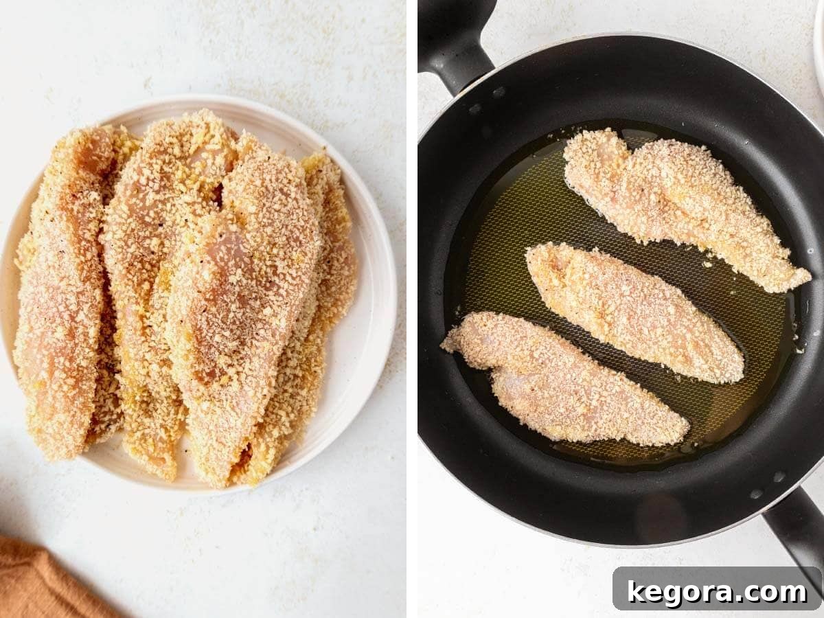 Crispy Skillet Chicken Cutlets 7 A plate of perfectly breaded raw chicken cutlets meticulously arranged and ready for cooking, positioned next to a large skillet actively pan-frying several golden brown cutlets in bubbling butter.