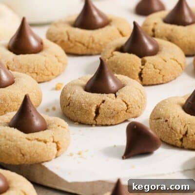 peanut butter blossoms on a wooden surface.
