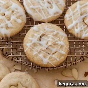 gluten free almond cookies on cooling rack topped with glaze
