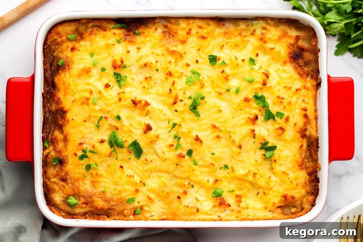 Freshly baked Irish Cottage Pie in a baking dish, golden and bubbling.