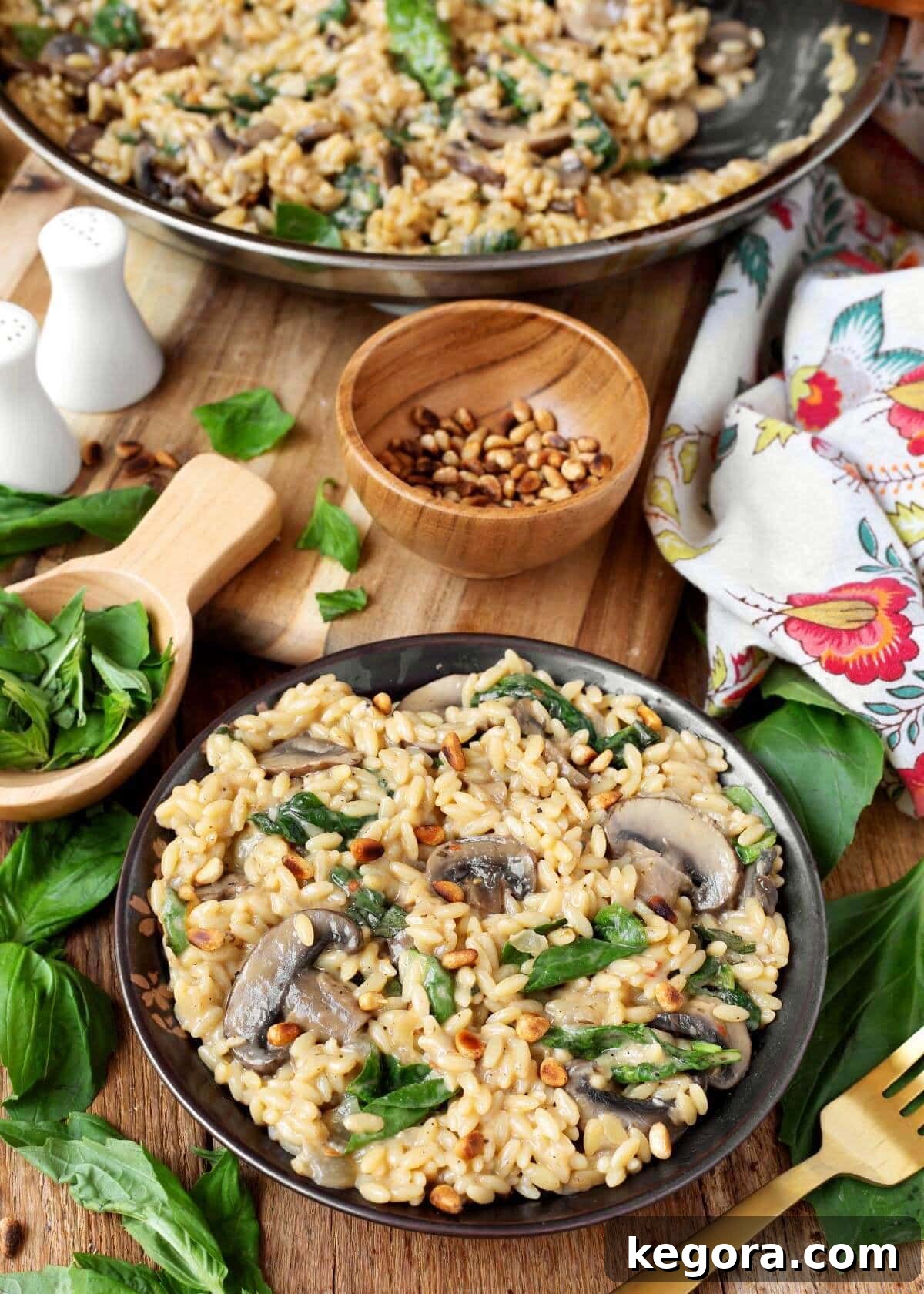 Spinach Mushroom Orzo in a bowl with garnishes