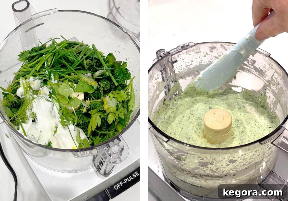food processor with sour cream and herbs in it, spatula scraping down sides.