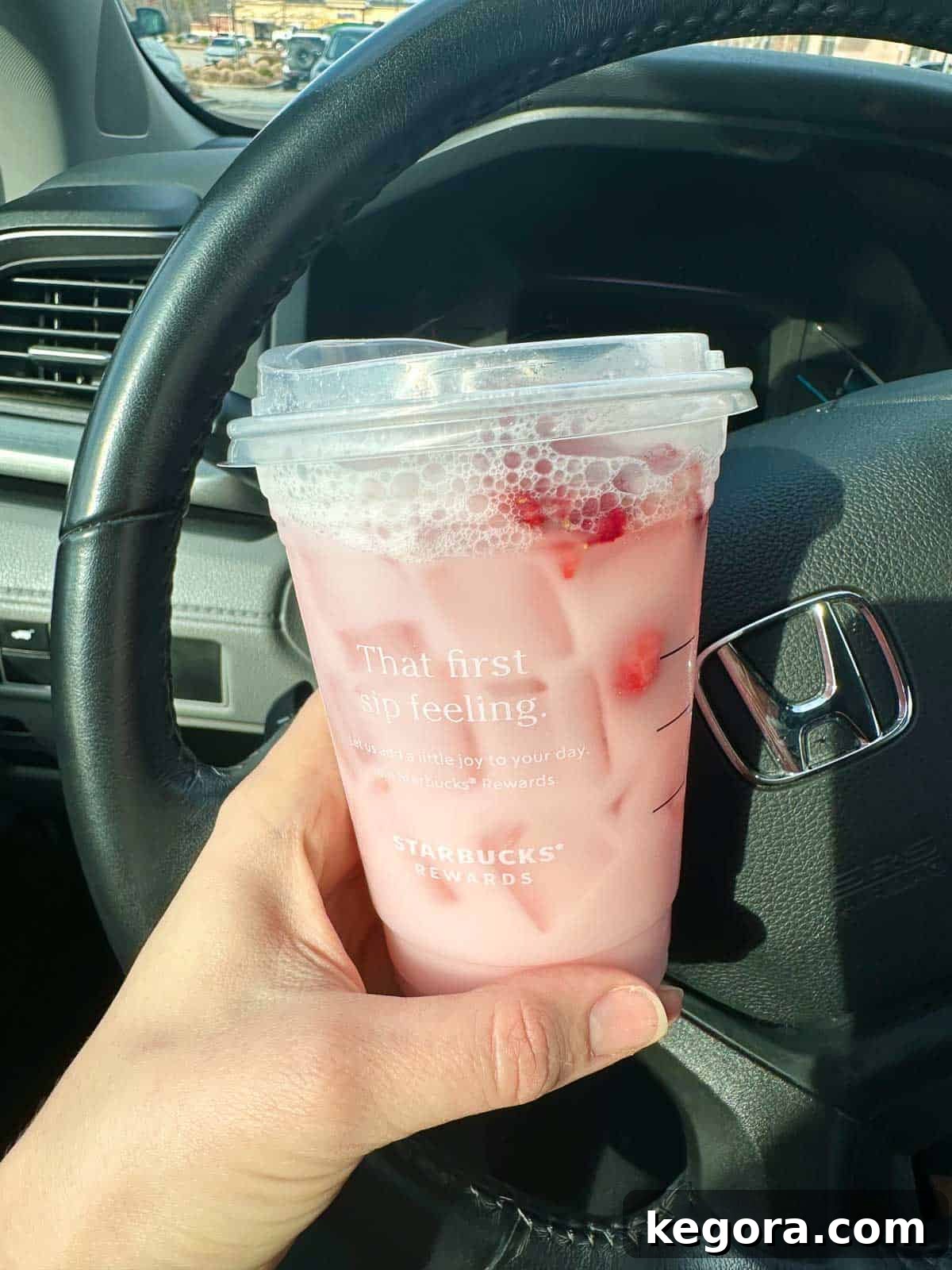 Starbucks Gluten-Free Menu Updates 2025 5 Close-up shot of a Starbucks Pink Drink held in hand, indicating gluten-free options