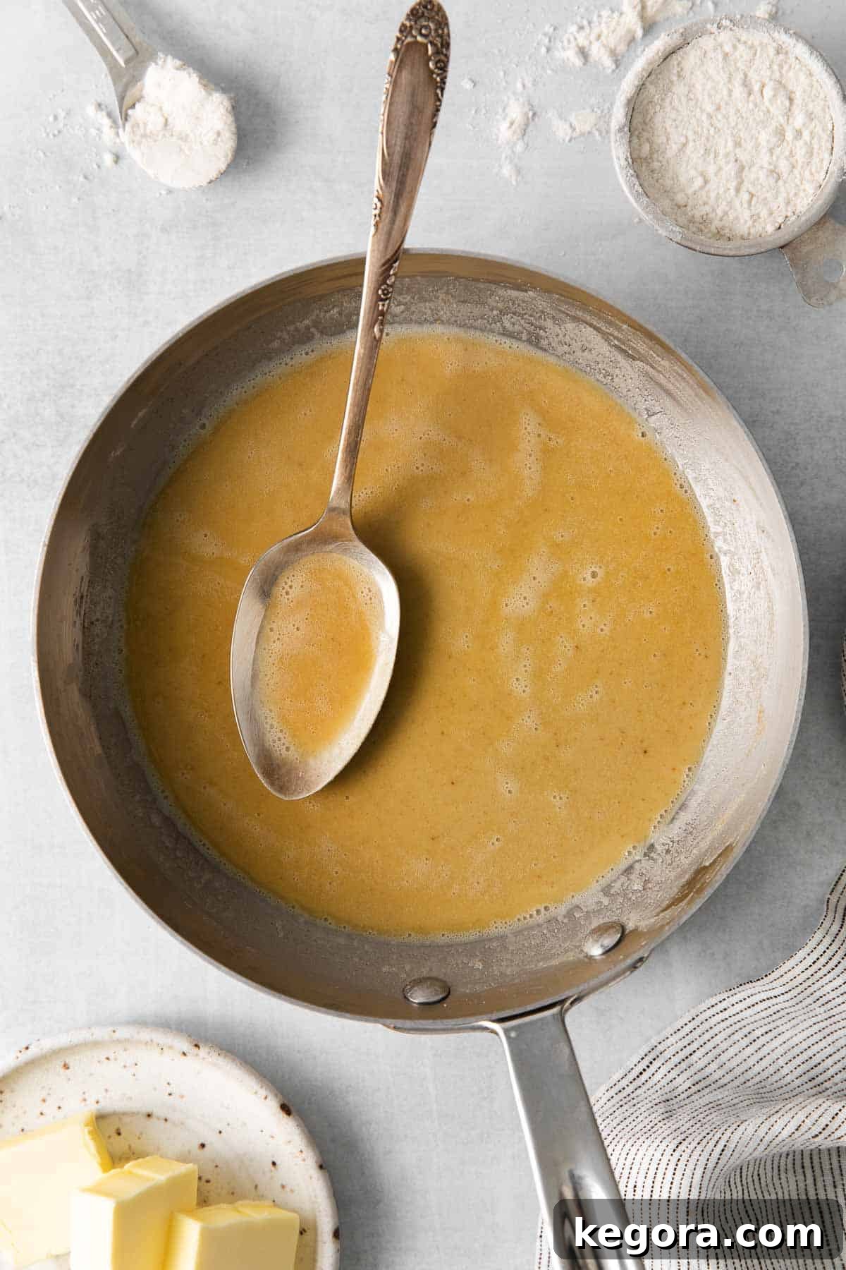 Easy Gluten-Free Roux 3 An overhead view of golden gluten-free roux simmering in a non-stick pan, ready for liquid.