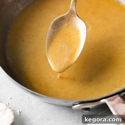 Gluten-free roux in a skillet with a spoon