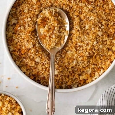Gluten-free breadcrumbs in a bowl with a spoon
