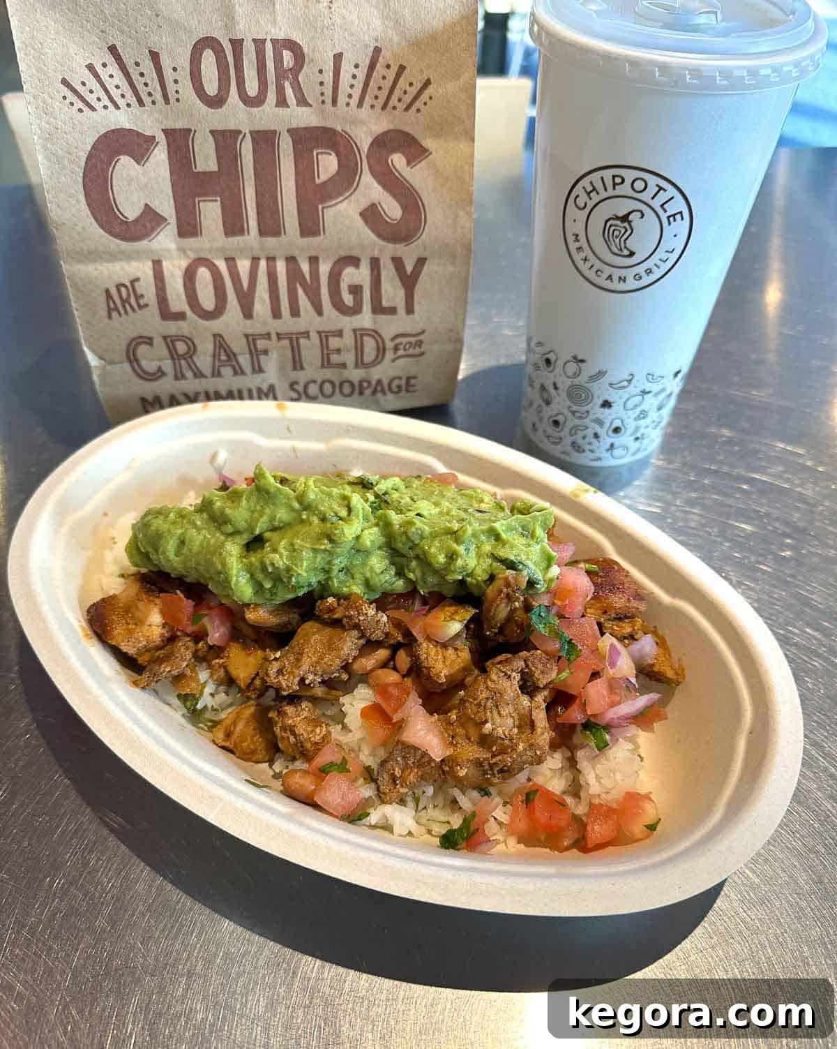 Gluten-free burrito bowl topped with guacamole from Chipotle.