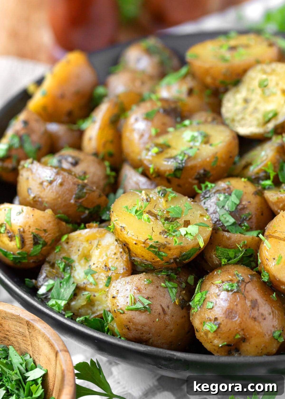 Savory Garlic Herb Slow Cooker Potatoes 9 Close-up view of perfectly cooked Slow Cooker Garlic Herb Potatoes, showcasing their tender texture and herb coating
