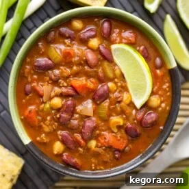 Instant Pot Chili in a bowl with a lime wedge, ready to be served.