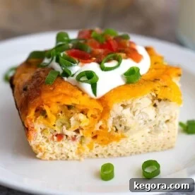 Slice of Breakfast Egg Bake on a white plate, ready to be enjoyed