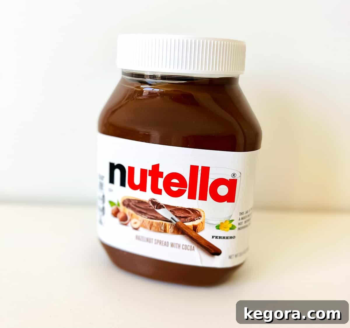 close up shot of jar of nutella with white background