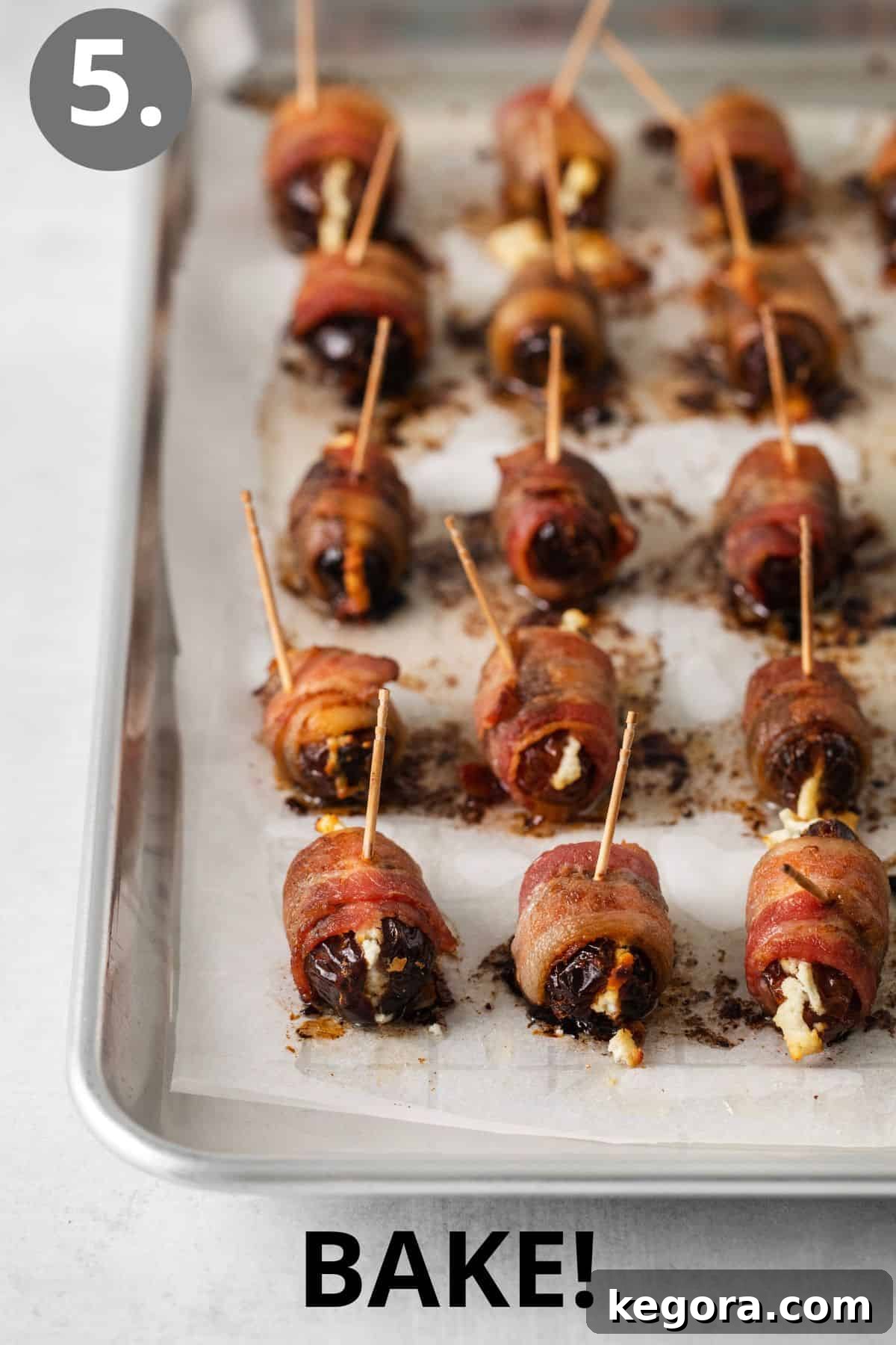 Freshly baked bacon-wrapped dates on a baking sheet, golden and crispy.
