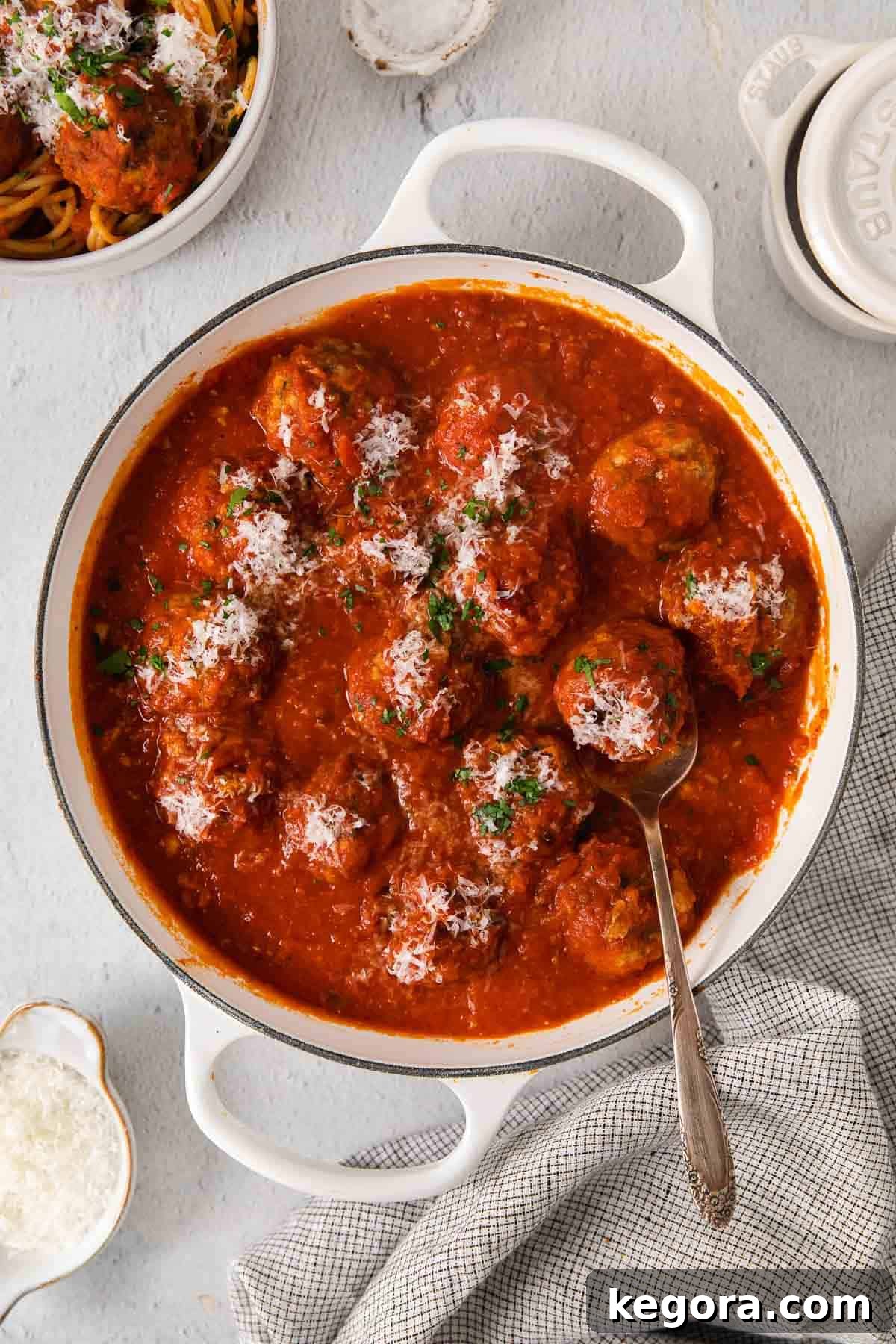 Traditional Italian Gluten Free Meatballs 2 Gluten-free meatballs in a pot on a countertop