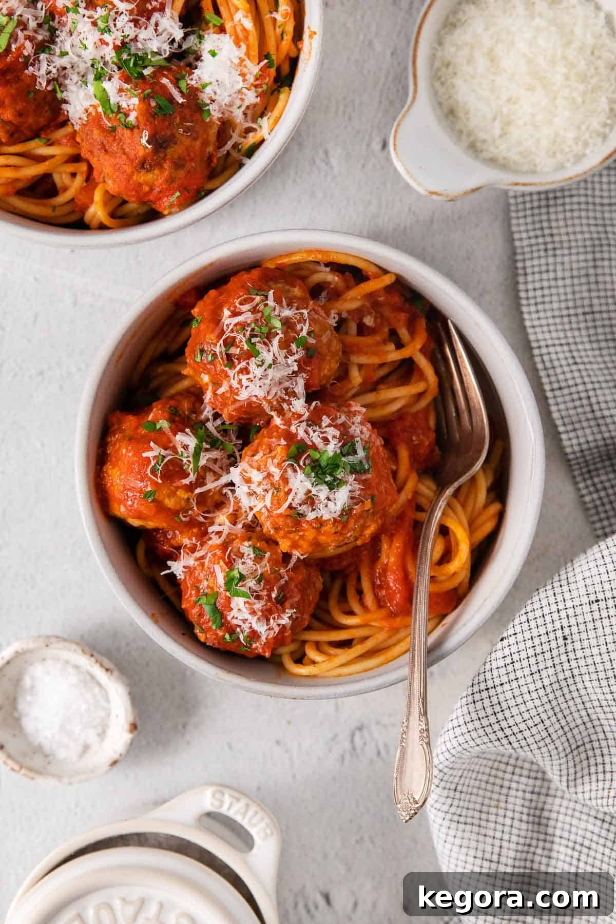 Traditional Italian Gluten Free Meatballs 10 Gluten-free meatballs in a bowl with spaghetti and a fork.