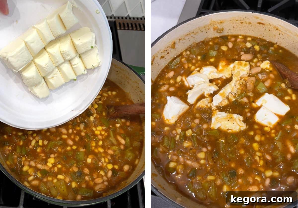 Plant-Powered White Bean Chili 9 Softened cream cheese being stirred into the hot chili for creaminess