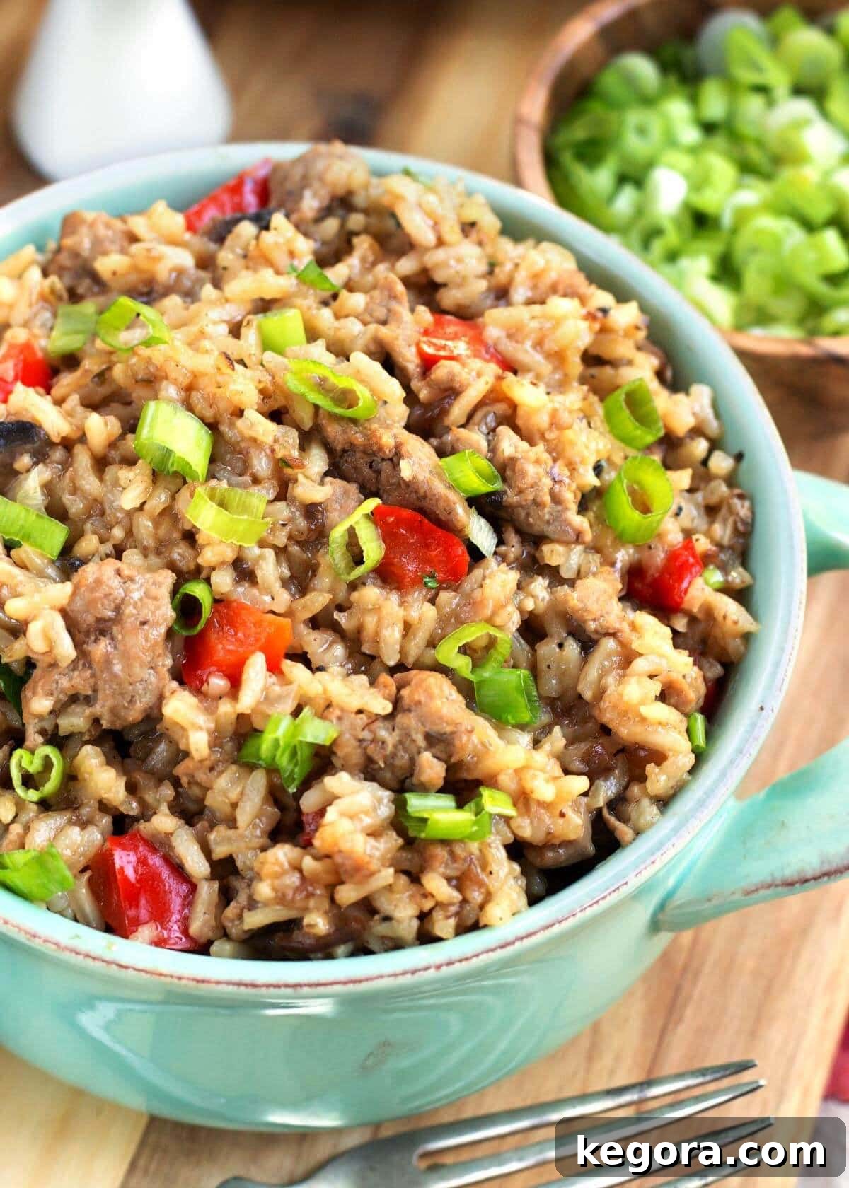 Delicious Hamburger Rice Casserole in a vibrant green serving bowl, ready to be enjoyed as a hearty family meal.
