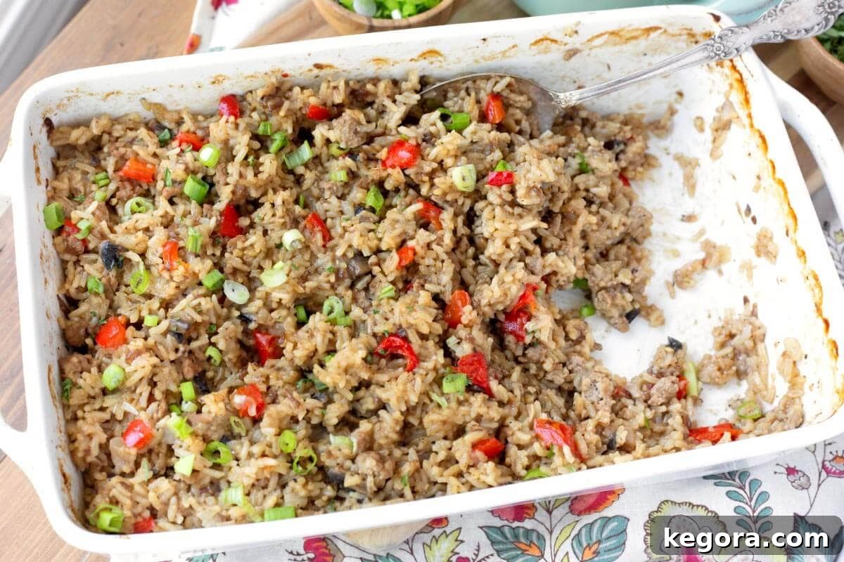The finished Hamburger Rice Casserole in a white baking dish, presented beautifully.