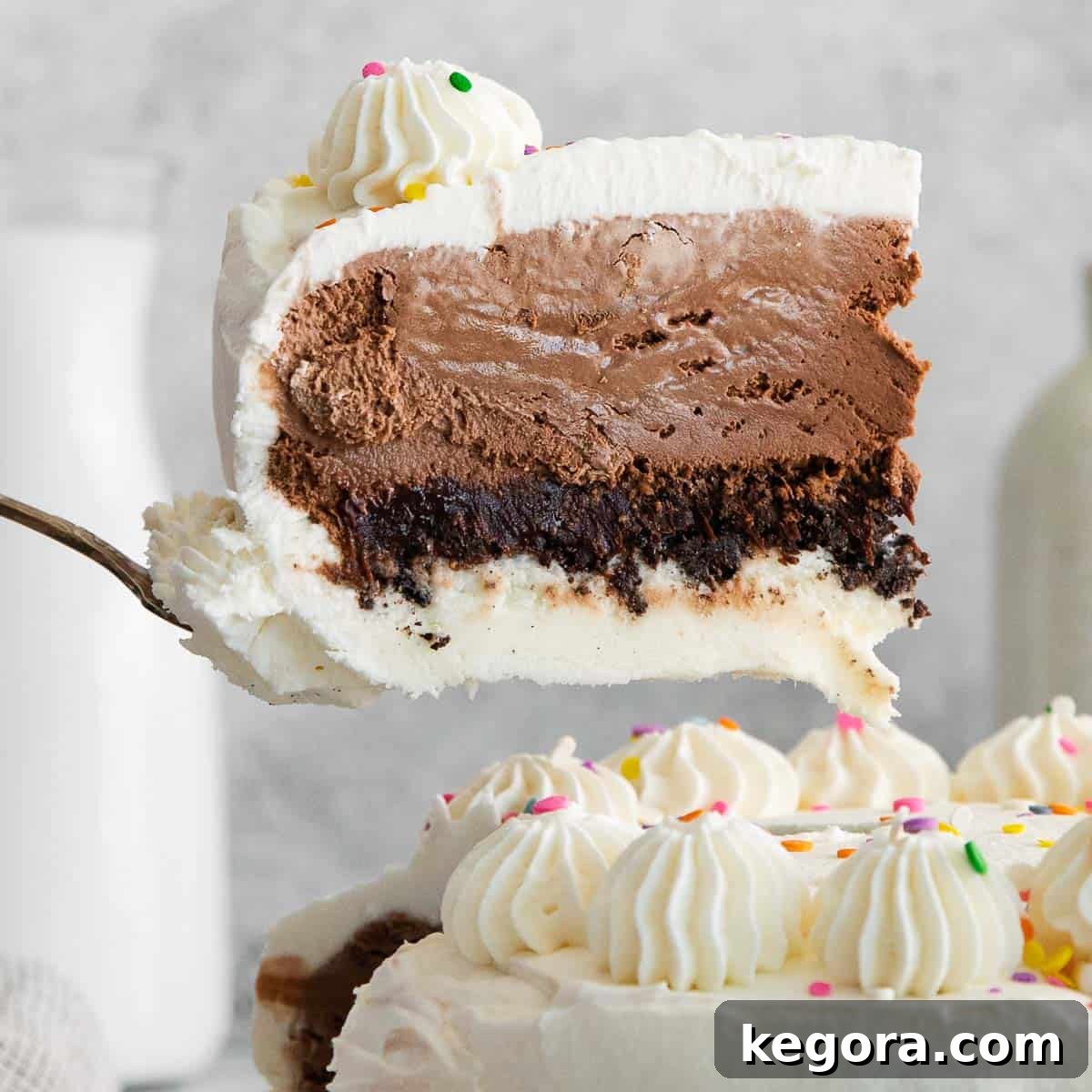 The Truth About Oreos and Gluten 4 A beautifully decorated slice of gluten-free ice cream cake, showing layers of cake, ice cream, and crumbled gluten-free Oreos.
