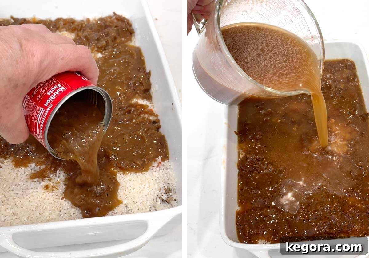 French onion soup is poured over the rice, followed by beef broth, preparing the casserole for baking.
