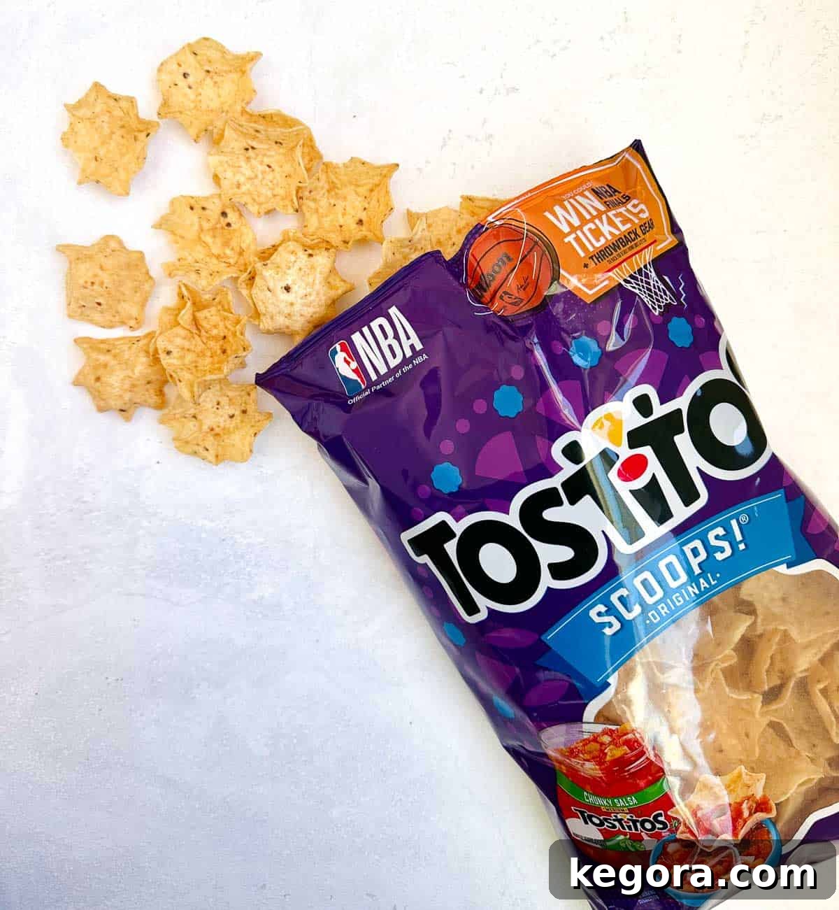 Unpacking Gluten in Tortilla Chips 4 tostitos chip bag open with chips coming out on white background
