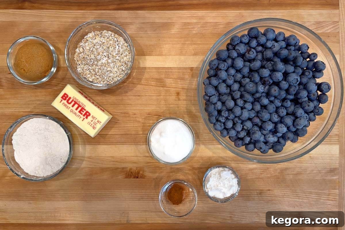 Blueberry Crisp recipe ingredients displayed on a wooden board