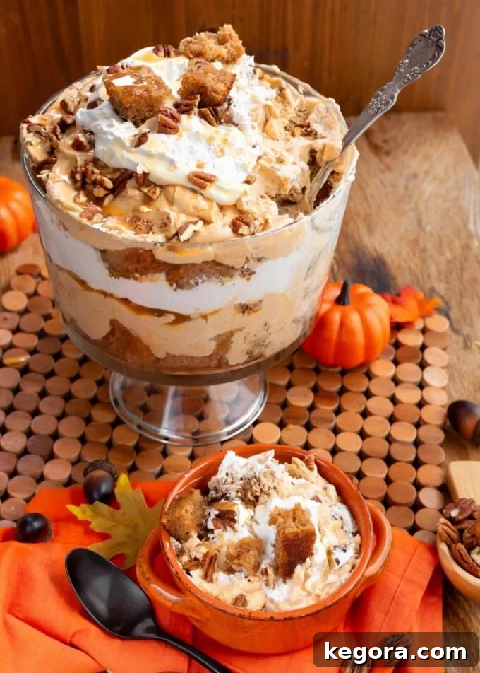 Stunning Make Ahead Pumpkin Trifle Fall Favorite 12 A fully assembled Pumpkin Trifle, garnished with pecans and caramel, in a festive fall setting.