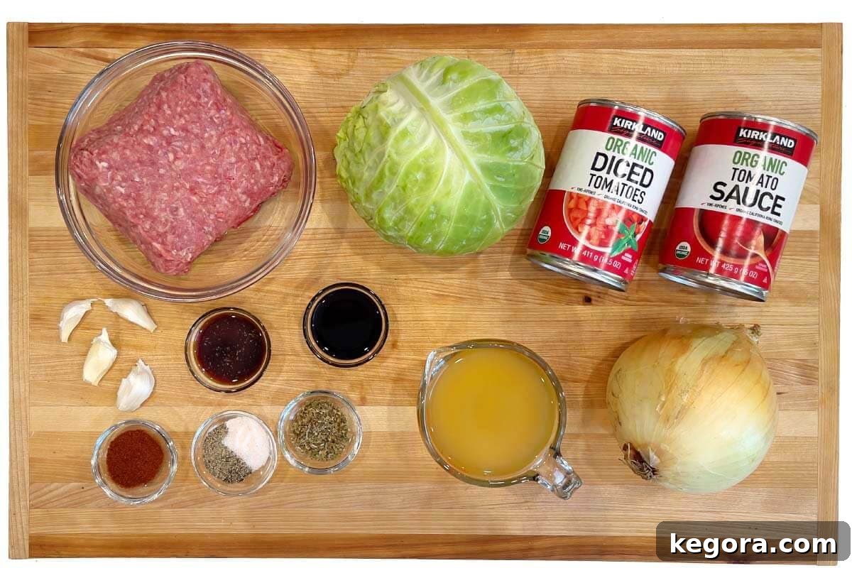 Savory One-Pan Beef and Cabbage Dinner 3 Fresh ingredients for making a delicious Ground Beef Cabbage Skillet, including beef, cabbage, onions, and tomatoes.
