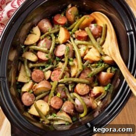 Crockpot Swamp Potatoes, a hearty Southern one-pot meal with potatoes, sausage, and green beans.