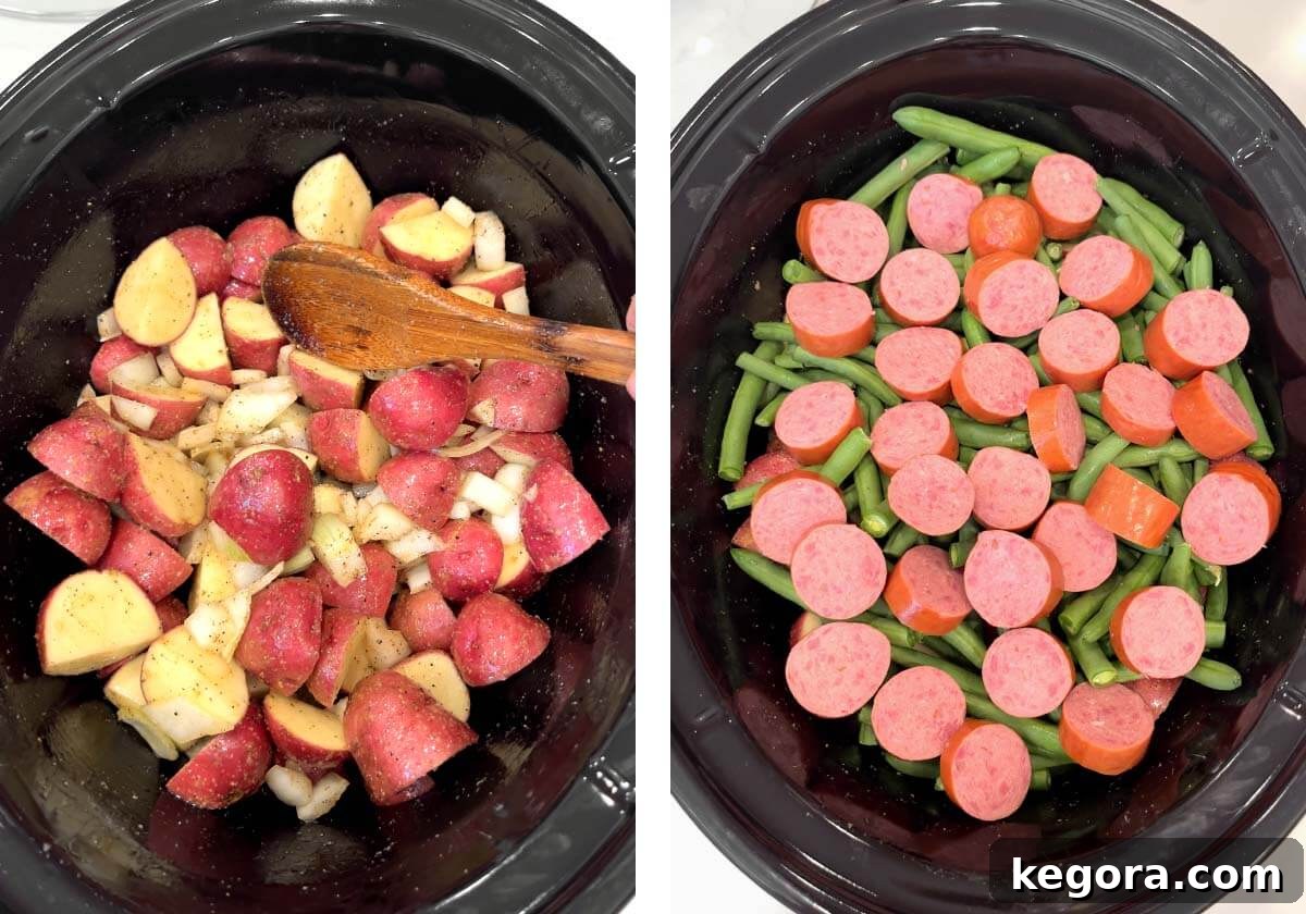Layered fresh green beans and sliced smoked sausage over seasoned potatoes and onion in a slow cooker.