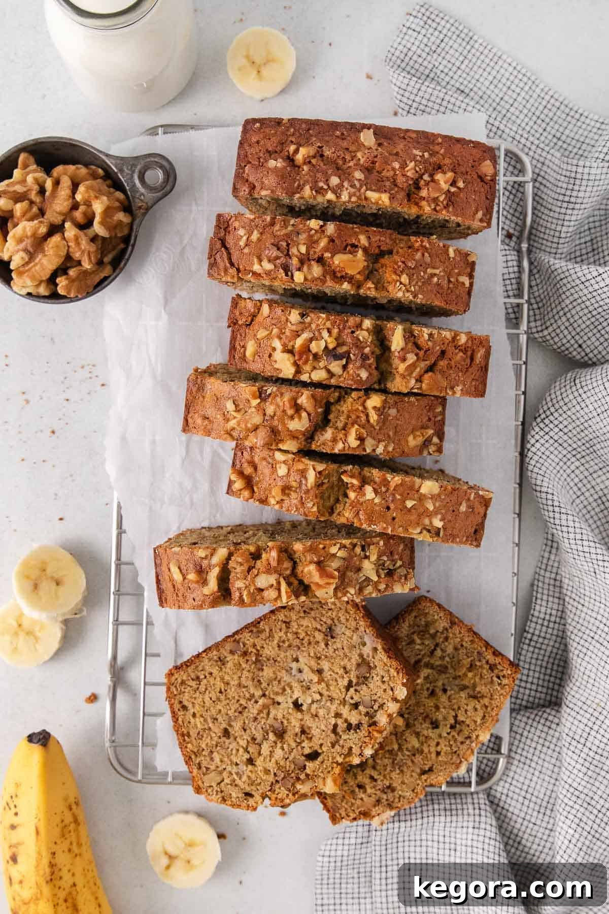 Wholesome Oat Banana Loaf 3 Golden brown oat flour banana bread cooling on a wire rack, ready to be sliced.