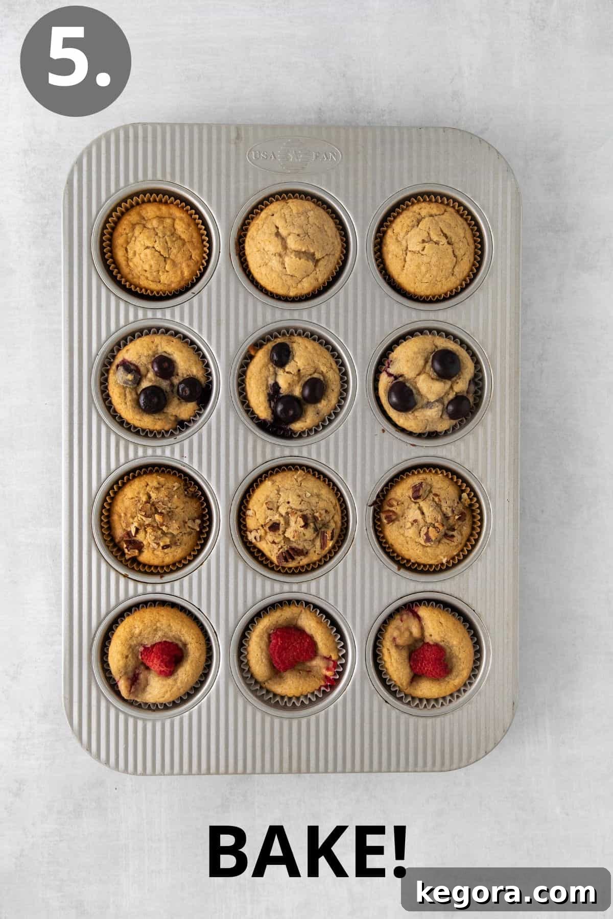 Wholesome Oat Muffins Infinite Variations 7 A tray of perfectly baked oat flour muffins, golden brown and domed, cooling in the muffin tin.