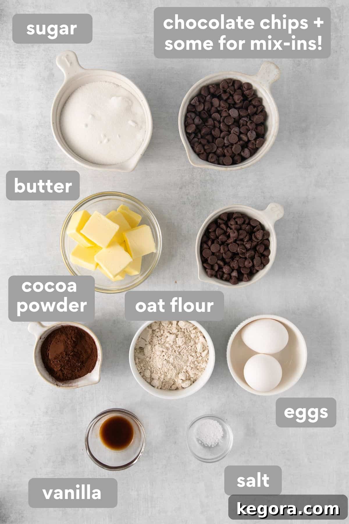 Collection of oat flour brownie ingredients neatly arranged on a kitchen counter, ready for baking