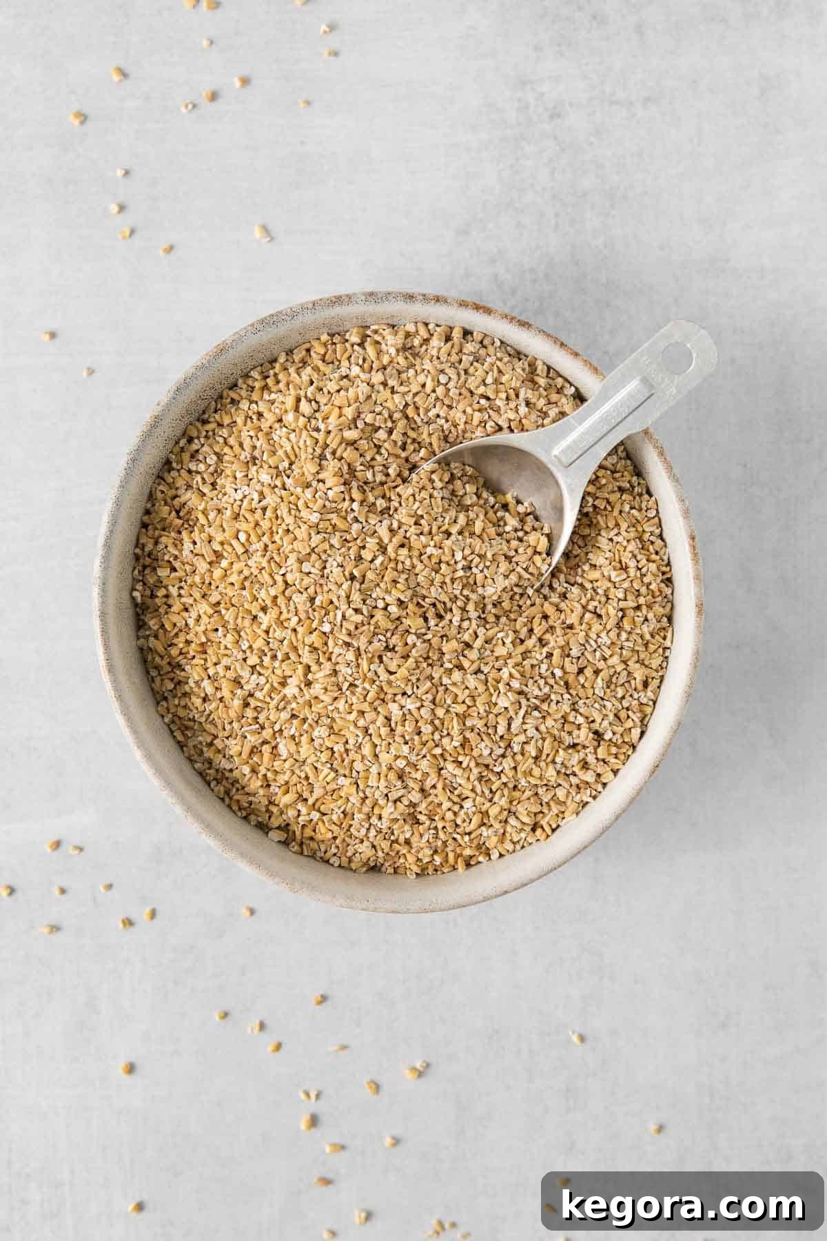 Wholesome Gluten-Free Steel Cut Oats 3 A close-up of creamy steel cut oats in a rustic bowl, with a spoon ready to serve, highlighting the delicious texture.