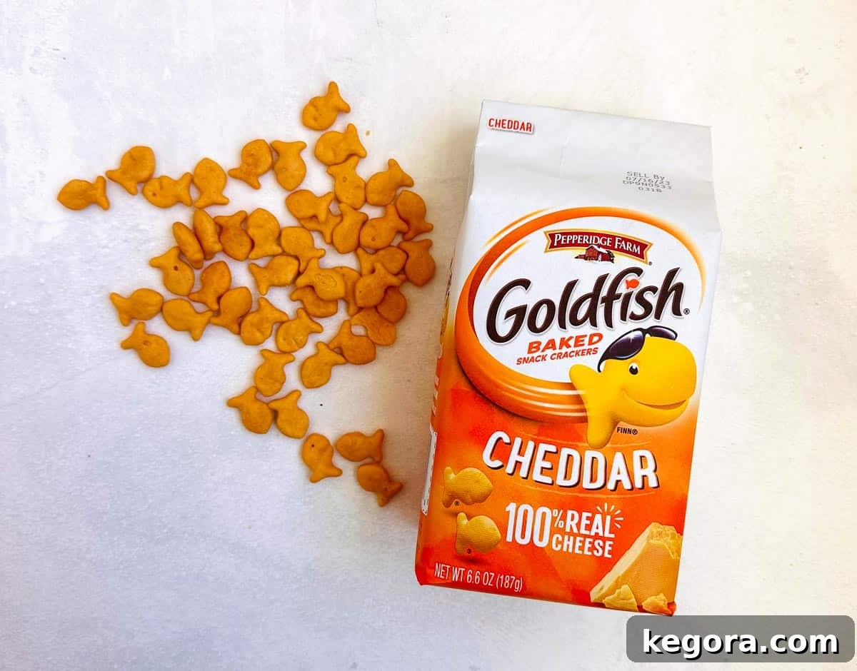 goldfish crackers next to their package on a clean white background, highlighting their familiar appearance