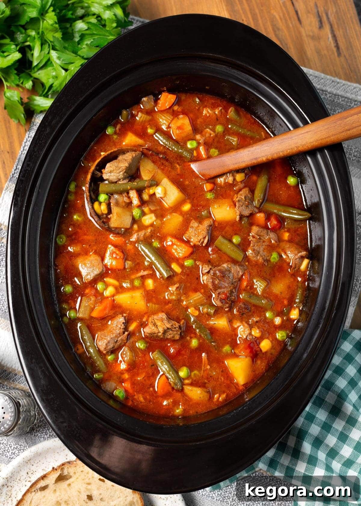 Wholesome Slow Cooker Beef and Garden Vegetable Soup 2 Hearty Crockpot Vegetable Beef Soup served in a rustic bowl with crusty bread